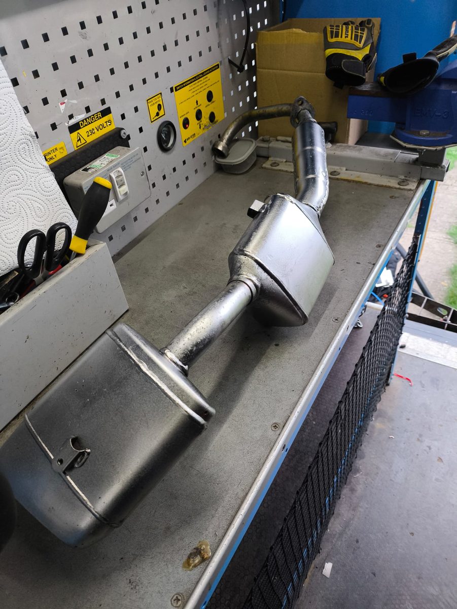 Clean, bare metal exhaust after laser rust removal